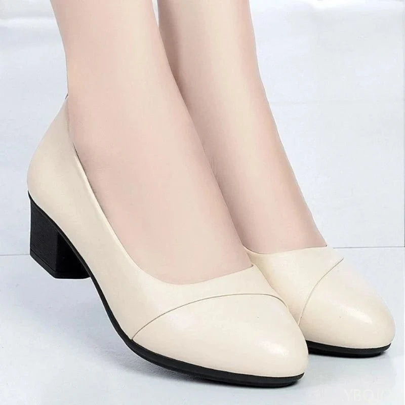 Women's mid heel slip-on pumps by TrendLux Wear with round toe design, ideal for office and professional work attire.
