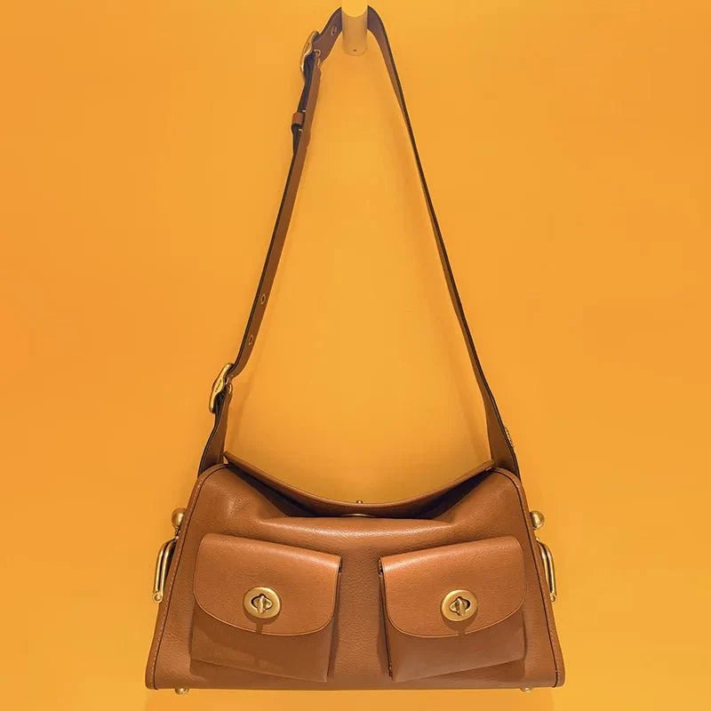 Women's vintage leather handbag by TrendLux Wear with large capacity, featuring a classic design and sturdy handles.