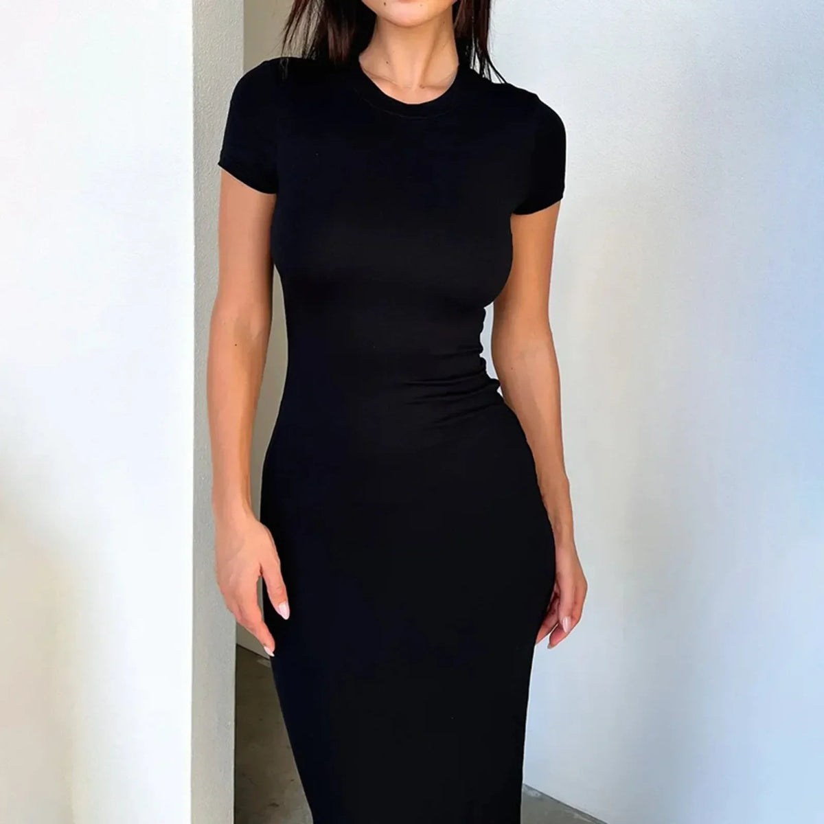 Women's long sleeve polyester-elastane dress by The Glow Sanctuary, showcasing a fitted silhouette and elegant design.