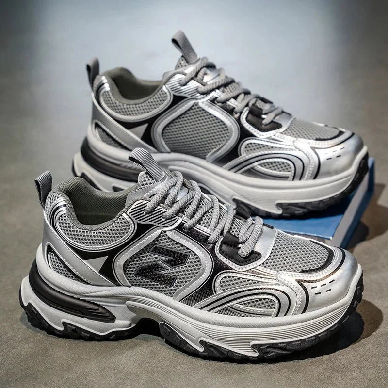 Men's chunky dad sneakers by TrendLux Wear with mesh and leather upper in beige, gray, and silver tones.