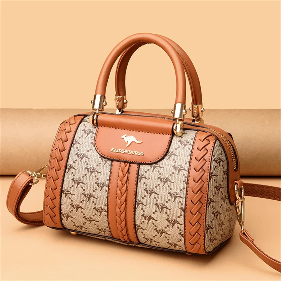 Brown and beige luxury handbag with a woven design, gold hardware, and dual top handles. Features an adjustable shoulder strap.