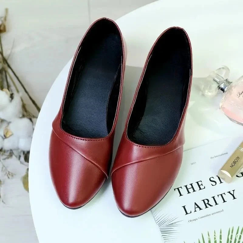 Women's mid heel slip-on pumps with round toe, TrendLux Wear office work shoes ideal for professional office settings.