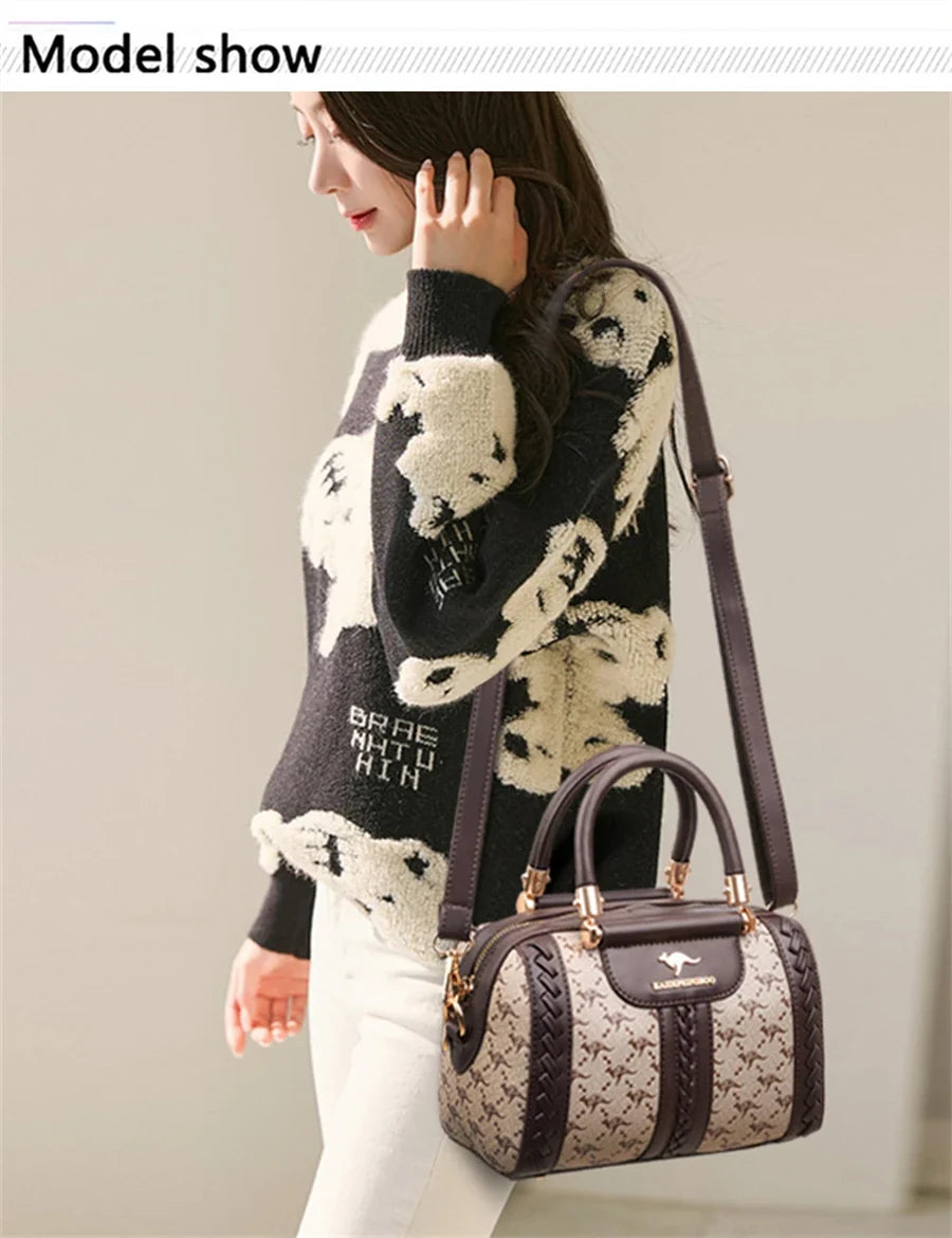 Structured handbag in soft PU leather with animal print, presented by a model wearing a patterned sweater and slim jeans.