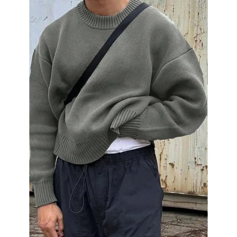 Close-up of TrendLux Wear's minimalist fleece-lined crew neck knit sweater in slim fit, available in four colors.