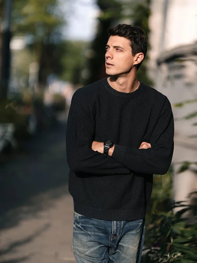 Men's oversized waffle-knit crewneck sweater in Heather Denim Blue by TrendLux Wear, showing close-up of textured fabric and relaxed fit.