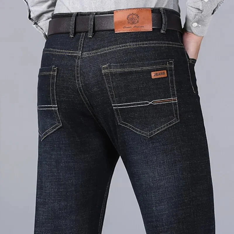 Men's slim fit black biker jeans by TrendLux Wear, classic straight leg style shown in size 32 with detailed stitching and fit.