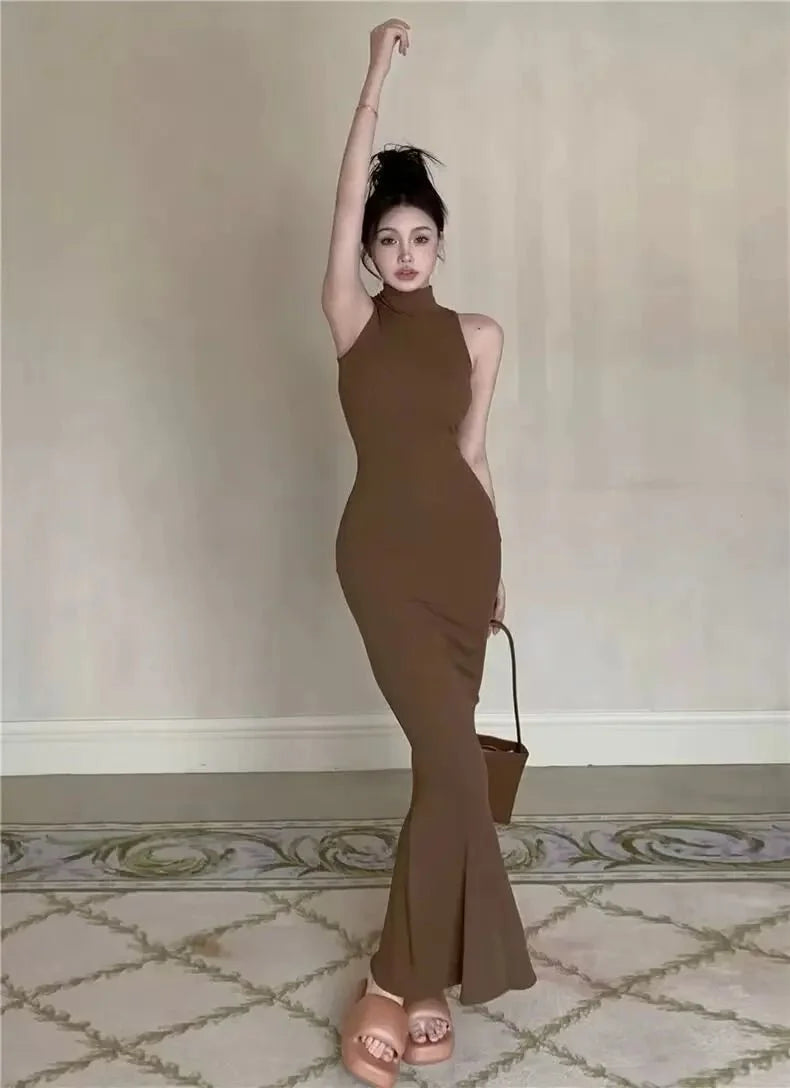 Women's knit turtleneck bodycon ankle-length maxi dress by The Glow Sanctuary, featuring a fitted silhouette and cozy knit fabric.