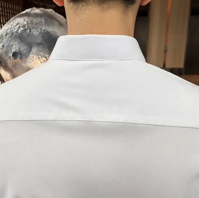 Short-sleeve white shirt with a square collar, presented from the back, showcasing the smooth fabric and clean lines.
