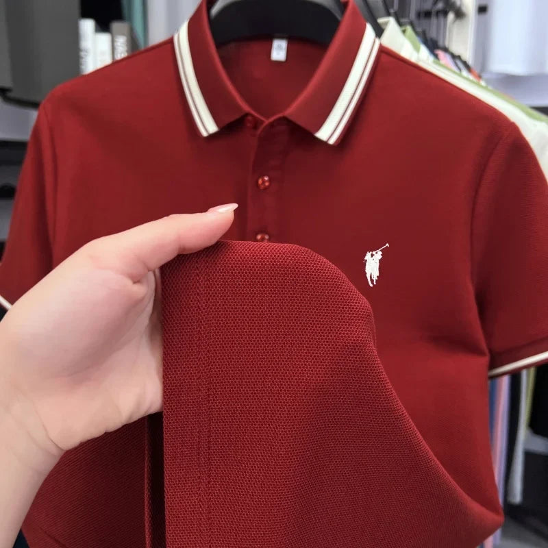 Deep red short sleeve polo shirt featuring a classic white-striped collar and embroidered pony logo on the chest.