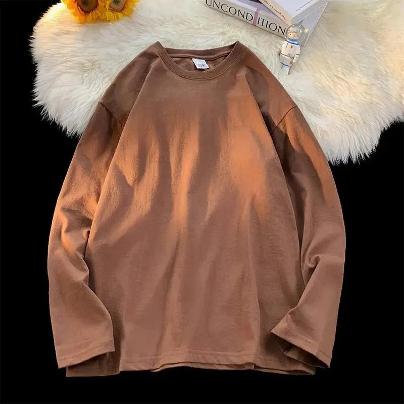 Unisex oversized long sleeve blank T-shirt from My Store 5 in neutral color, available in sizes S to 3XL, streetwear essential.