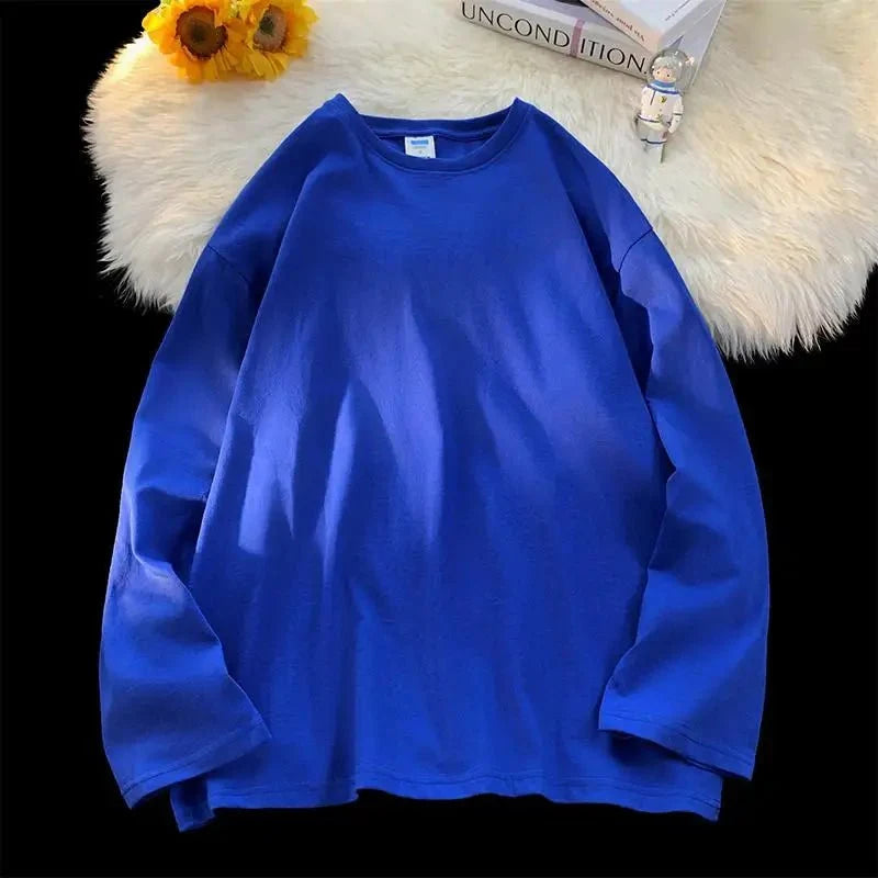 Unisex oversized long sleeve blank T-shirt from My Store 5 in various colors, showing relaxed fit and soft fabric.