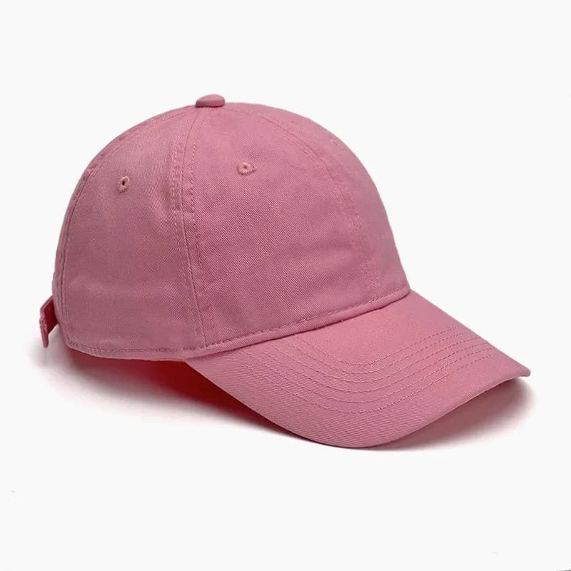 Unisex soft-top dad hat by TrendLux Wear, plain baseball cap with sun protection in black, showing front view and adjustable strap