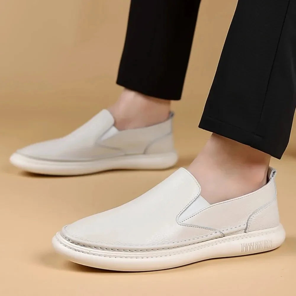 Men's genuine leather casual loafers by TrendLux Wear, breathable slip-on flat shoes in solid color with a sleek, comfortable design.