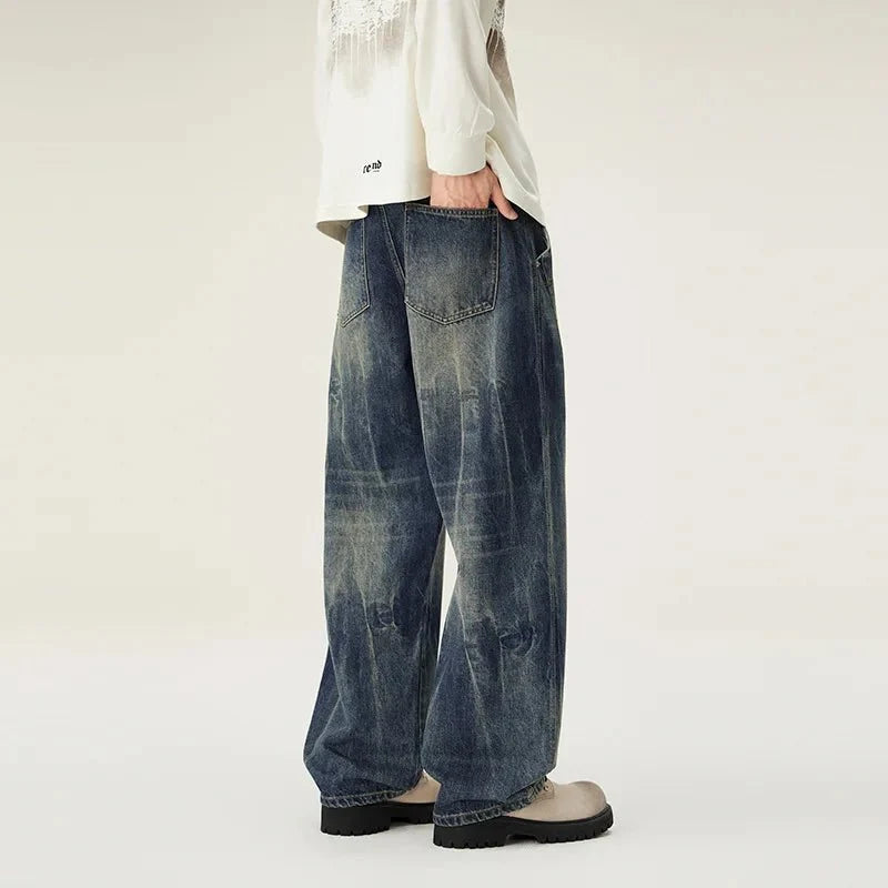 Men's loose straight-leg distressed jeans by TrendLux Wear with casual, versatile denim style and fashionable distressed details.