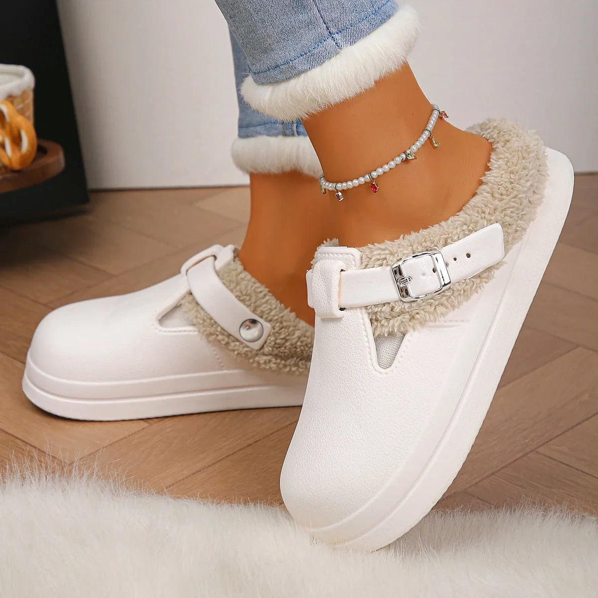 TrendLux Wear women's waterproof furry mule slippers with plush EVA soles, metal buckle, and non-slip indoor slide design.