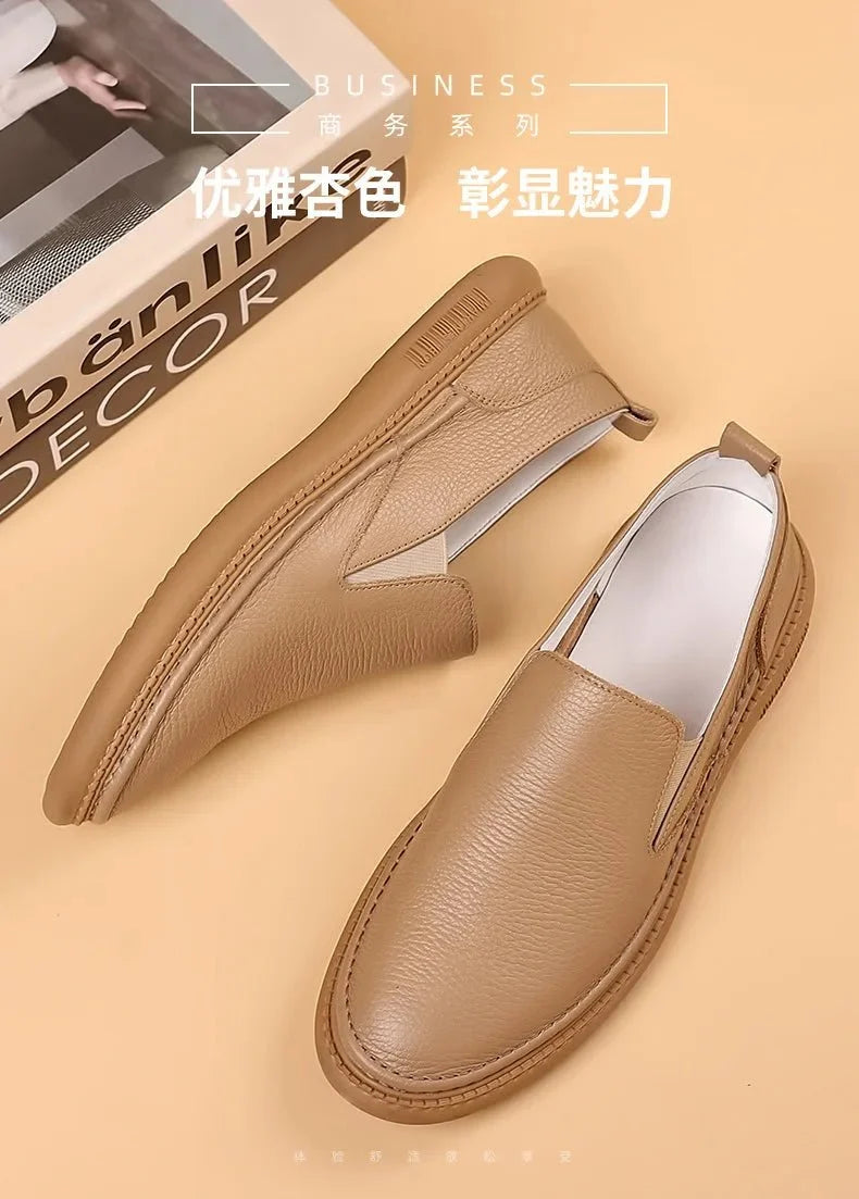 Men's genuine leather casual loafers by TrendLux Wear, breathable slip-on flat shoes in a solid color, perfect for everyday wear.