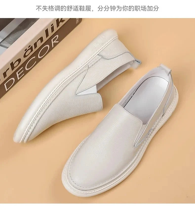 Men's genuine leather casual loafers by TrendLux Wear, breathable slip-on flat shoes in solid color with a sleek, comfortable design.