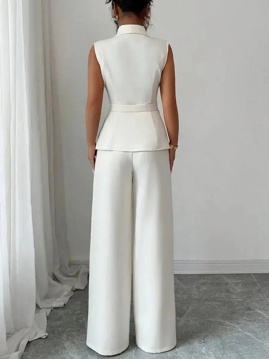 Women's spring sleeveless 2-piece suit by TrendLux Wear, featuring a stylish top and matching pants in vibrant fabric.