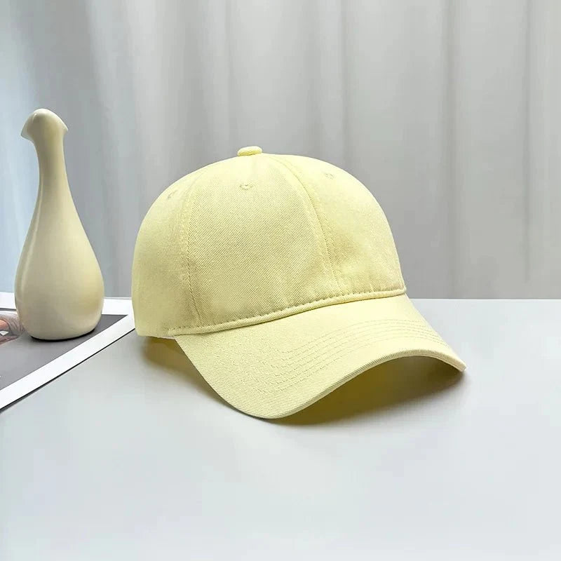 Unisex Korean style high-end cotton curved brim baseball cap by TrendLux Wear in soft fabric, shown in multiple colors.