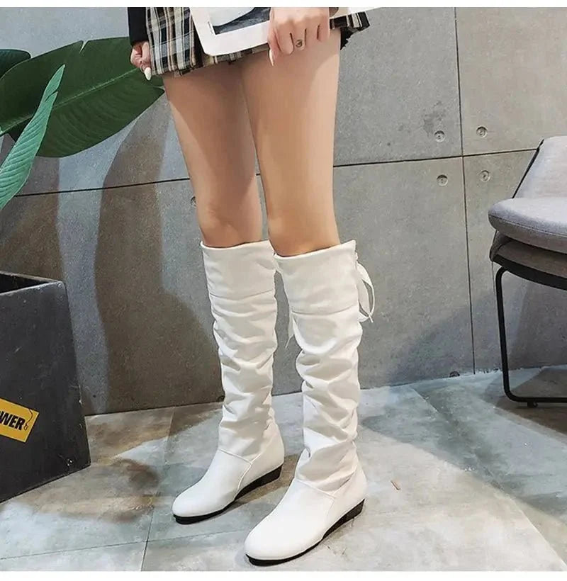 Women's pleated lace-up knee-high boots by TrendLux Wear, featuring stylish design and tall boot silhouette.