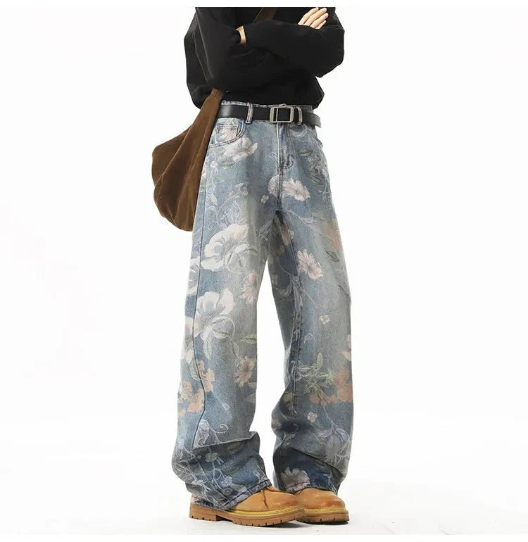 Men's retro floral print jeans by TrendLux Wear featuring loose wide-leg denim for a casual hip-hop style.
