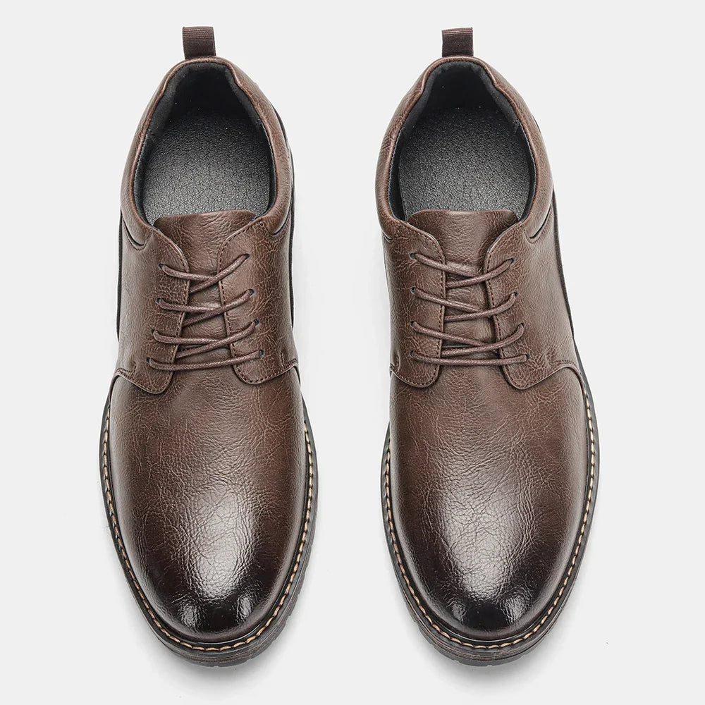 Brown leather derby shoes featuring a round toe and lace-up closure, with a rubber sole for stability.