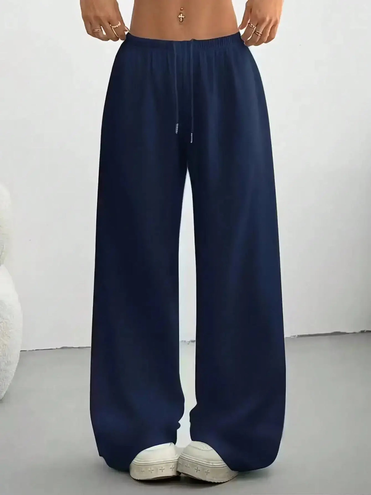 Ladies' casual wide-leg jogging pants from TrendLux Wear, shown in a relaxed fit with a comfortable waistband and stylish design.