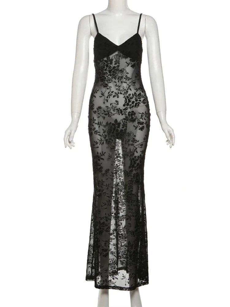 Black sleeveless see-through dress featuring a backless design and floral patchwork detail, with a slim fit to the ankle.