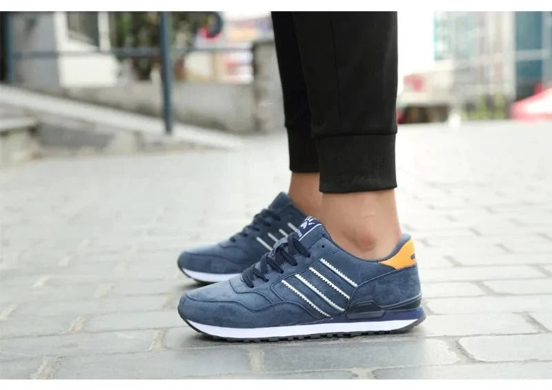 Men's luxury suede running sneakers by TrendLux Wear featuring breathable, anti-odor sport shoes with stylish design.