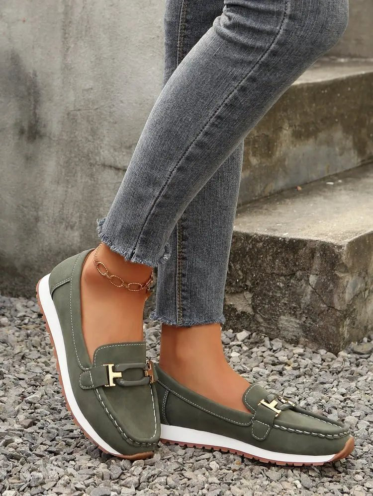 Women’s slip-on flat shoes with buckle detail, stylish and comfortable, by TrendLux Wear, perfect for casual wear.