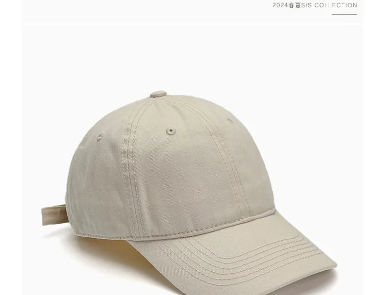 Unisex soft-top dad hat by TrendLux Wear, plain baseball cap with sun protection in 21 colors, shown in black.