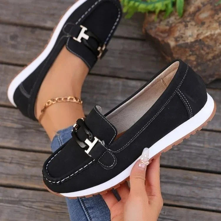 Women's buckle flat slip-on shoes by TrendLux Wear, featuring a stylish design with a buckle detail and comfortable flat sole.