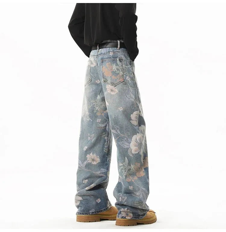 Men's retro floral print jeans by TrendLux Wear featuring loose wide-leg denim for a casual, hip-hop style.