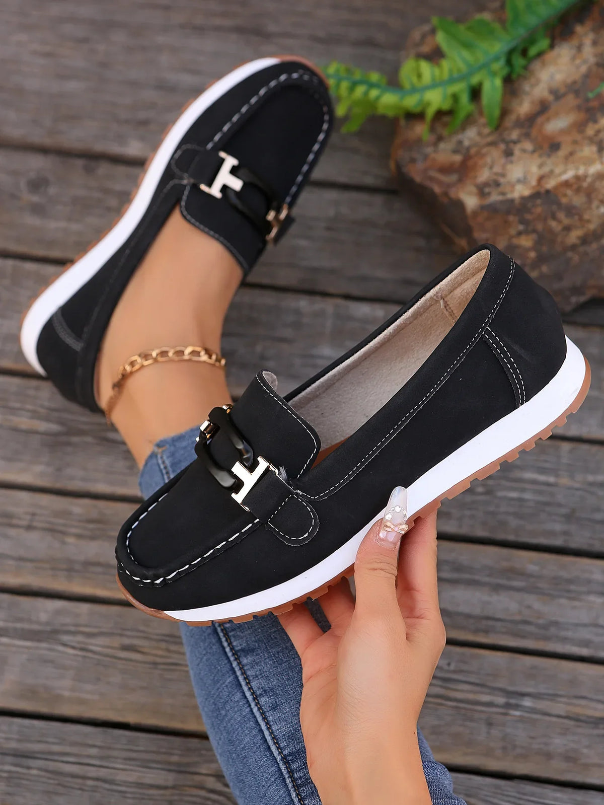 Women's slip-on flat shoes with buckle detail from TrendLux Wear, showcasing a sleek, comfortable design perfect for casual wear.