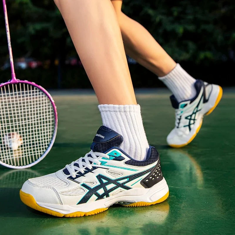 Unisex TrendLux Wear athletic court sneakers with anti-slip soles for badminton and table tennis, black and white design.