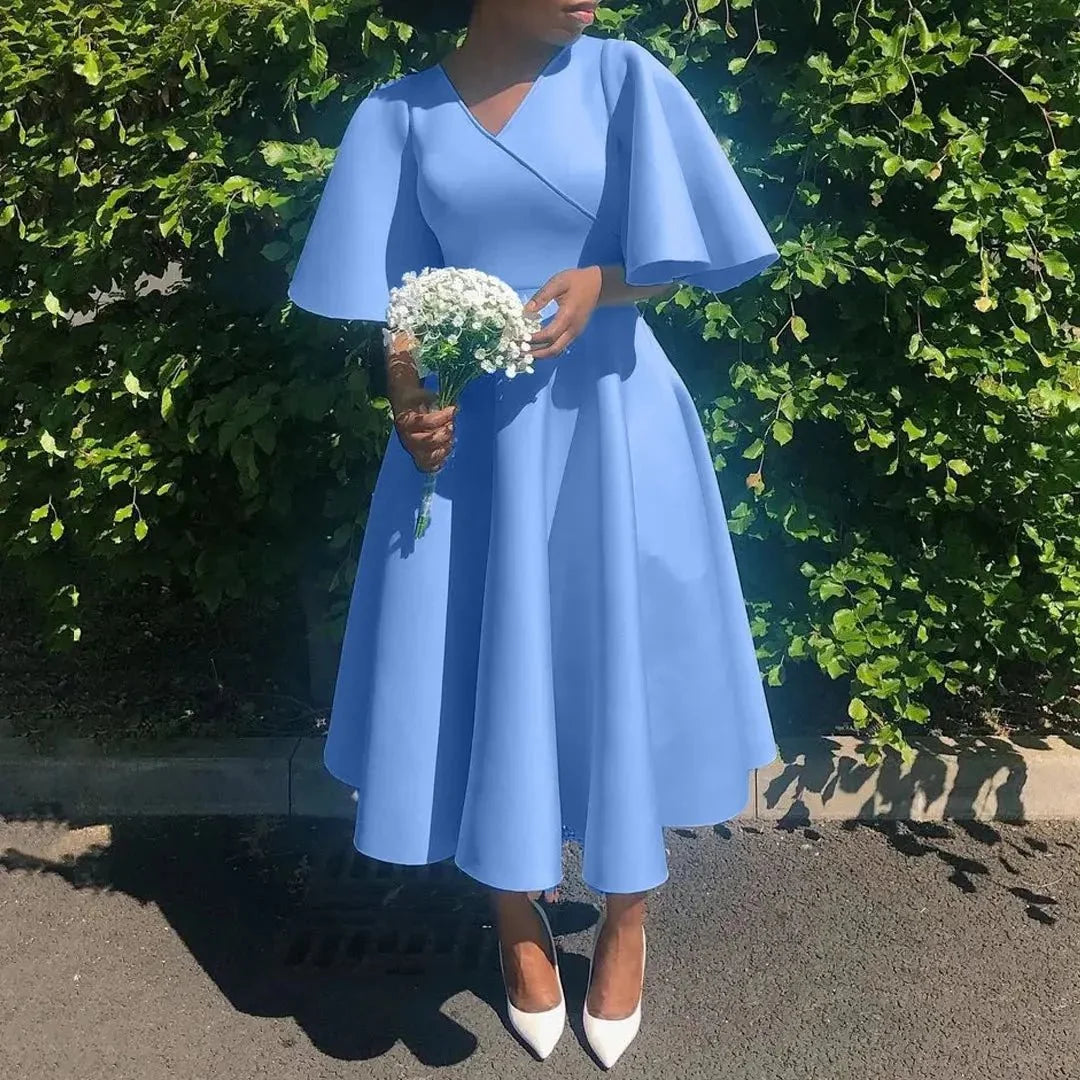 Women's polyester high waist flare sleeve pleated A-line midi dress by The Glow Sanctuary, shown with a flowing, elegant silhouette.