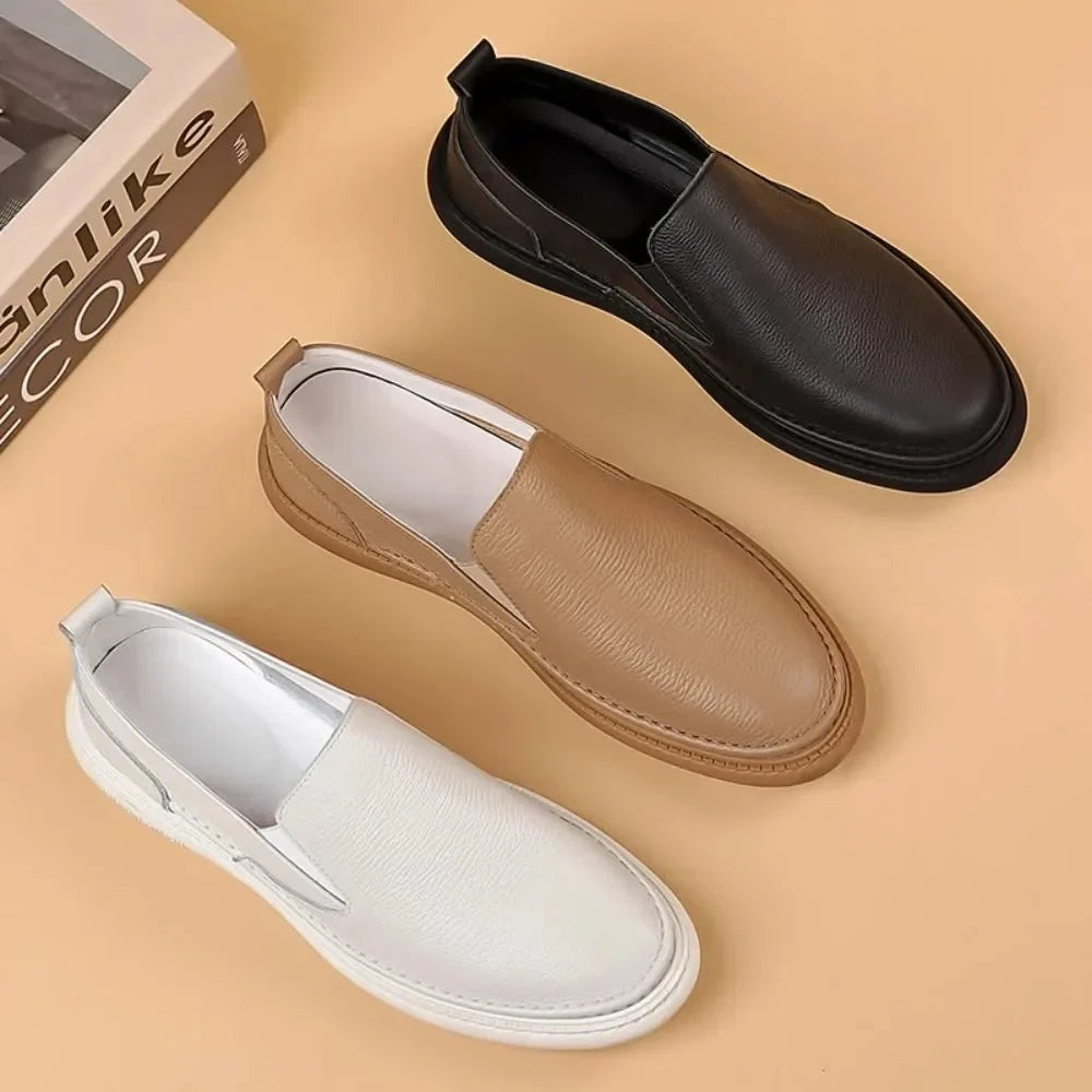 Men's genuine leather casual loafers by TrendLux Wear, breathable slip-on flat shoes in solid color, showing a close-up of the style.