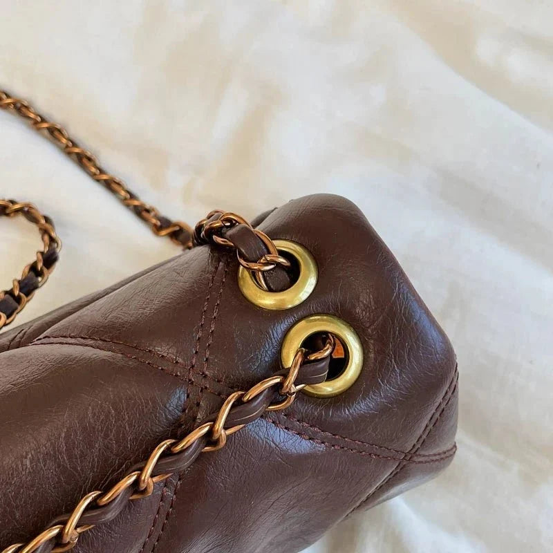 Women's luxury Lingge pattern pure leather handbag by TrendLux Wear, featuring elegant design and detailed craftsmanship.