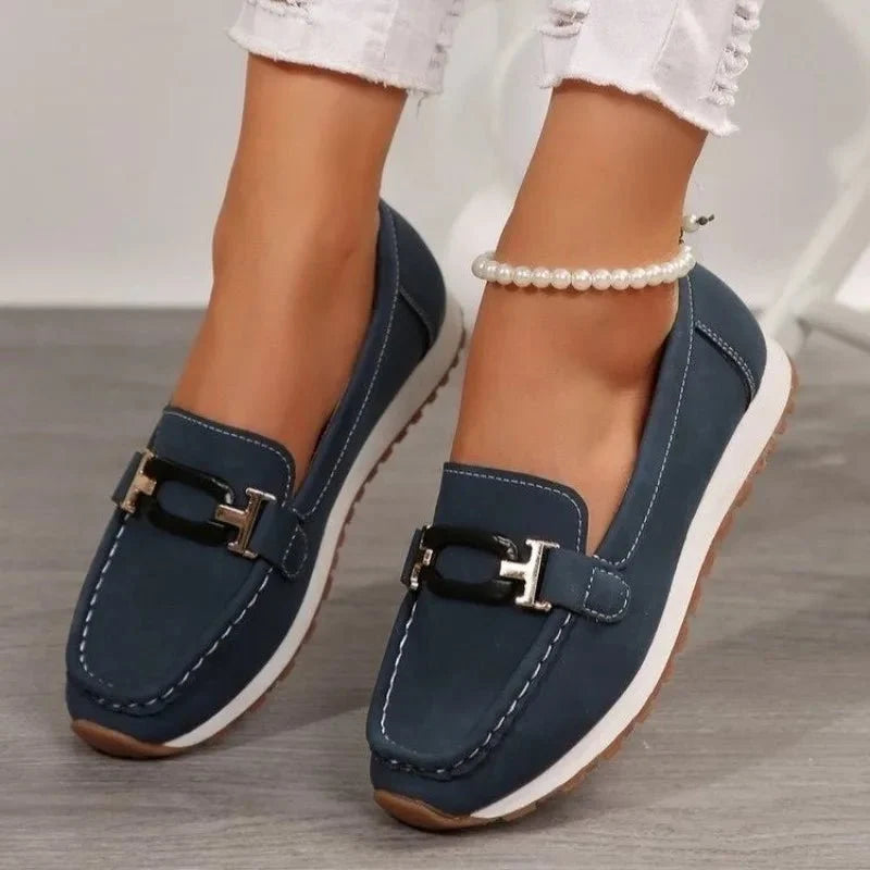 Women's slip-on flat shoes with buckle detail from TrendLux Wear, featuring a stylish and comfortable design perfect for everyday wear.