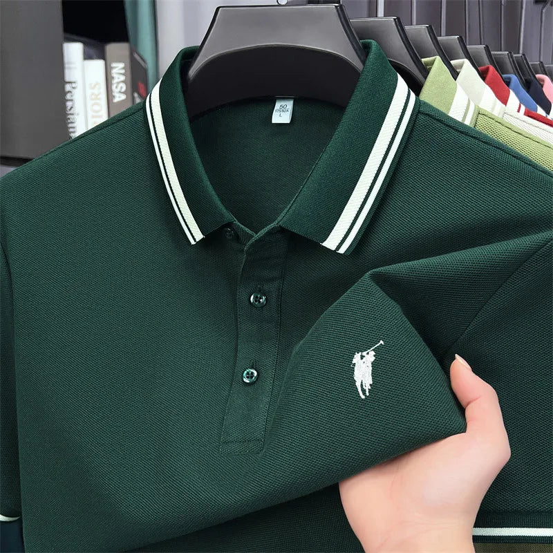 Short sleeve polo shirt in dark green, featuring white striped collar and embroidered pony logo. Made of breathable cotton.