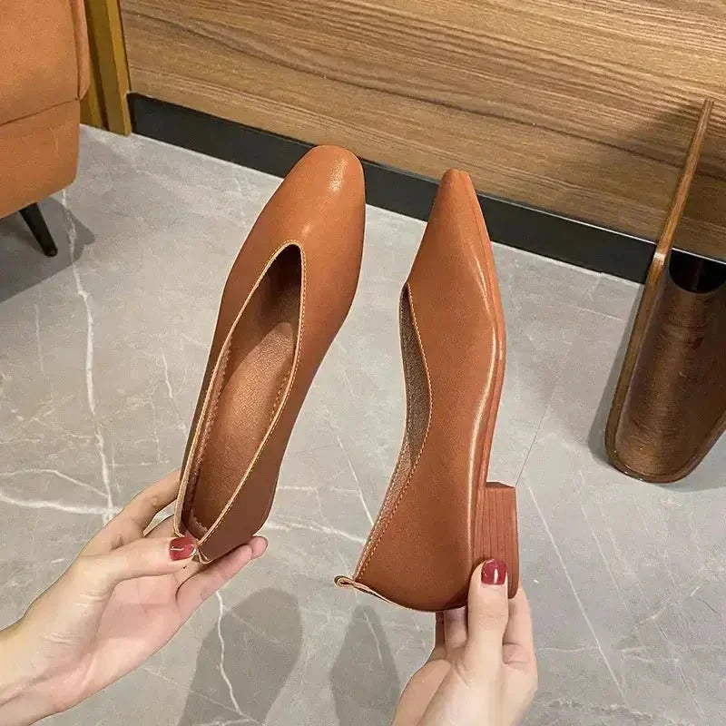 Women's round-toe leather loafer flats by TrendLux Wear, shown in classic style with smooth leather and comfortable slip-on design.