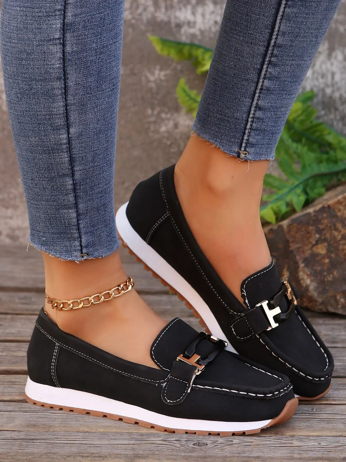 Women's slip-on flat shoes with buckle detail by TrendLux Wear, showcasing a stylish and comfortable footwear option.