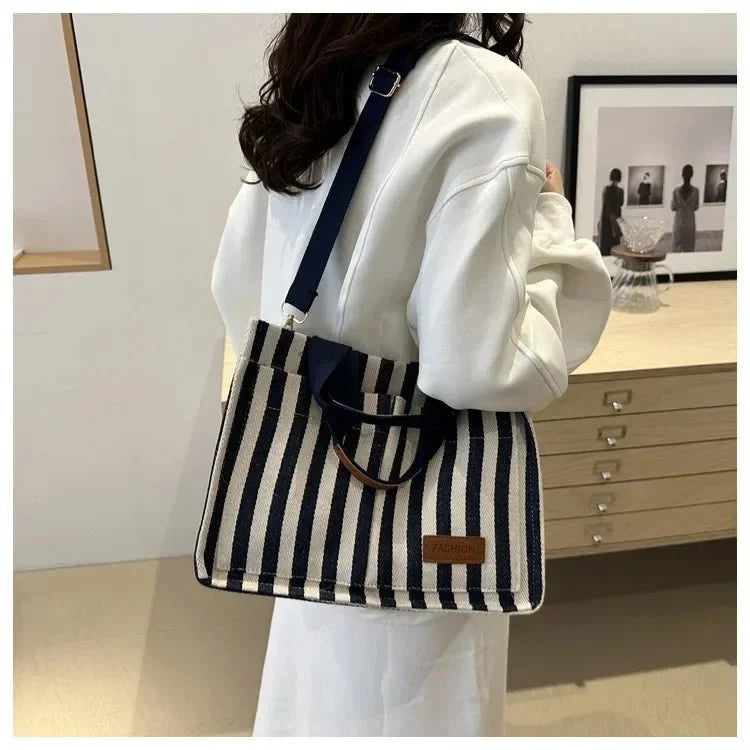 Women's large capacity striped shoulder handbag by TrendLux Wear, featuring a stylish design and spacious interior.