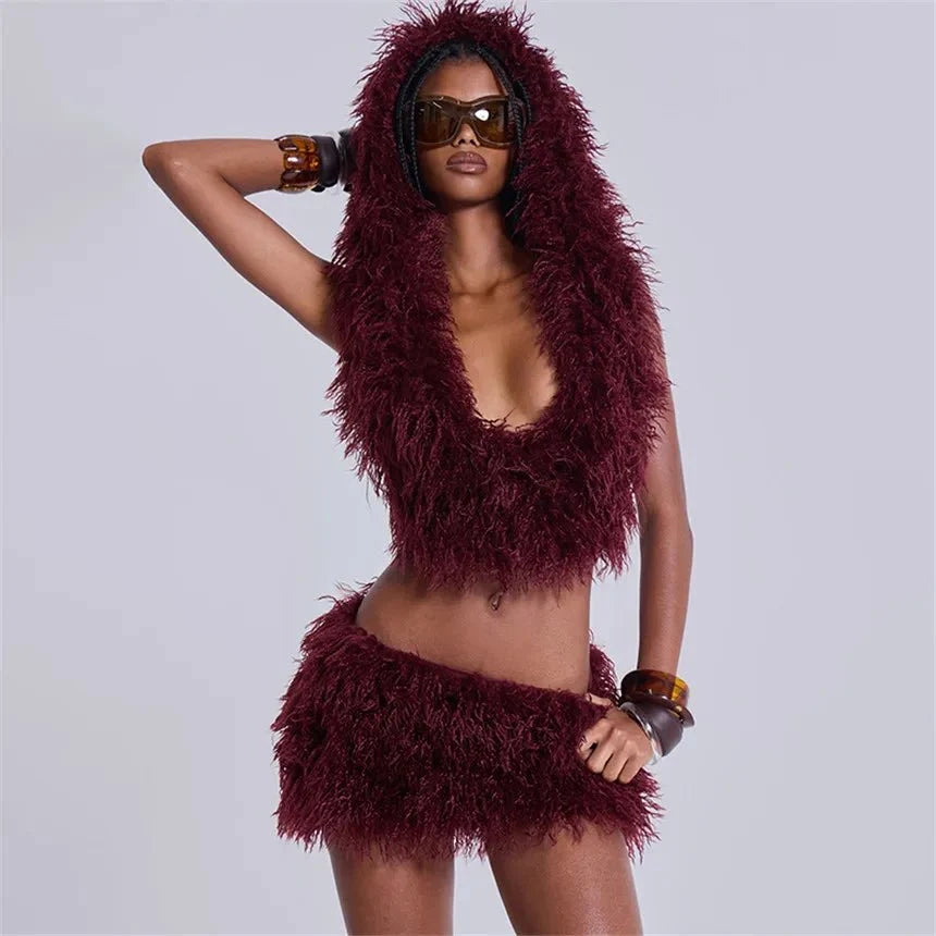 Women's faux fur 2-piece set from TrendLux Wear featuring a lace-up backless tank top and bodycon mini skirt, perfect for night out.