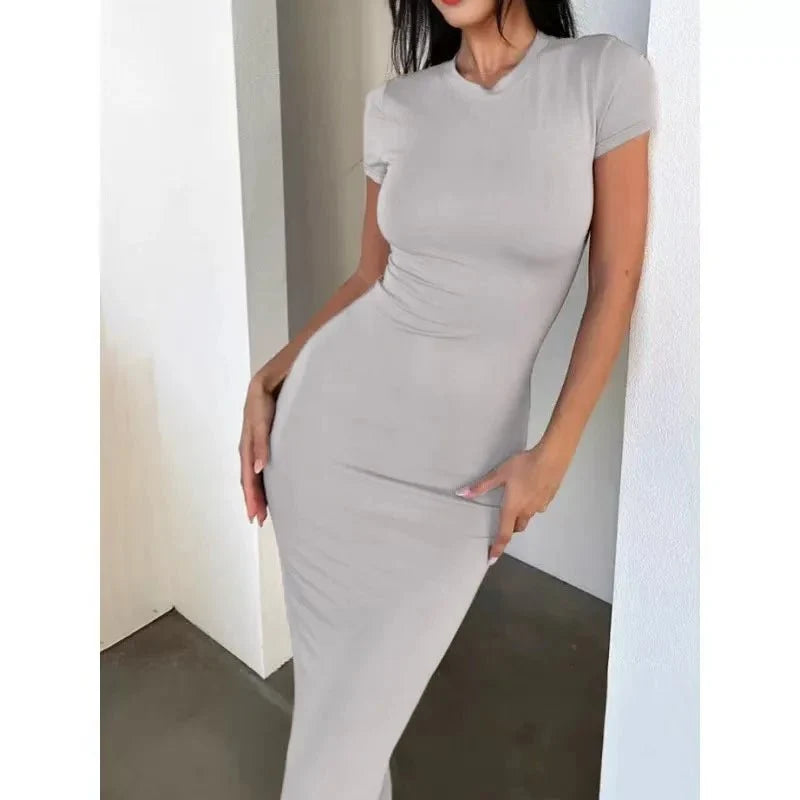 Women's long sleeve polyester-elastane dress by The Glow Sanctuary, fitted style with a sleek, modern design.