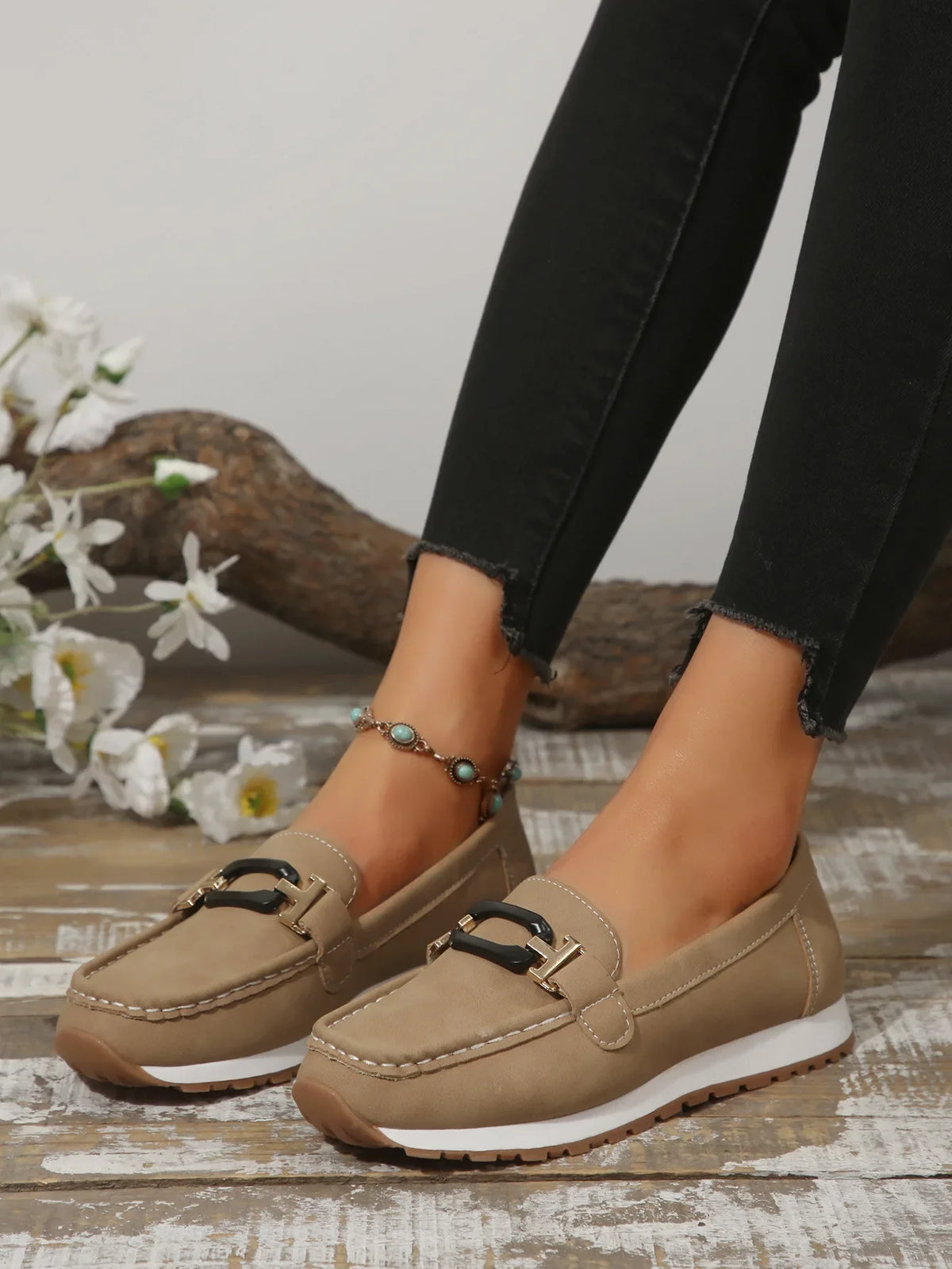 Women's buckle flat slip-on shoes by TrendLux Wear, featuring a stylish design with a buckle detail and comfortable flat sole.