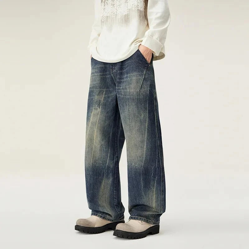 Men's loose straight leg distressed jeans by TrendLux Wear, featuring casual versatile denim with a relaxed fit and stylish distressed details.