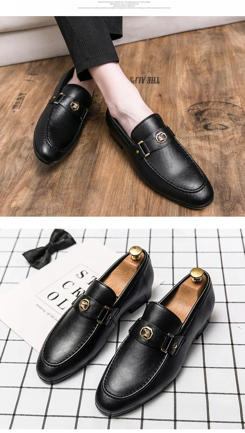 Black leather slip-on loafers featuring a round toe and a metal buckle detail, ideal for formal or casual settings.