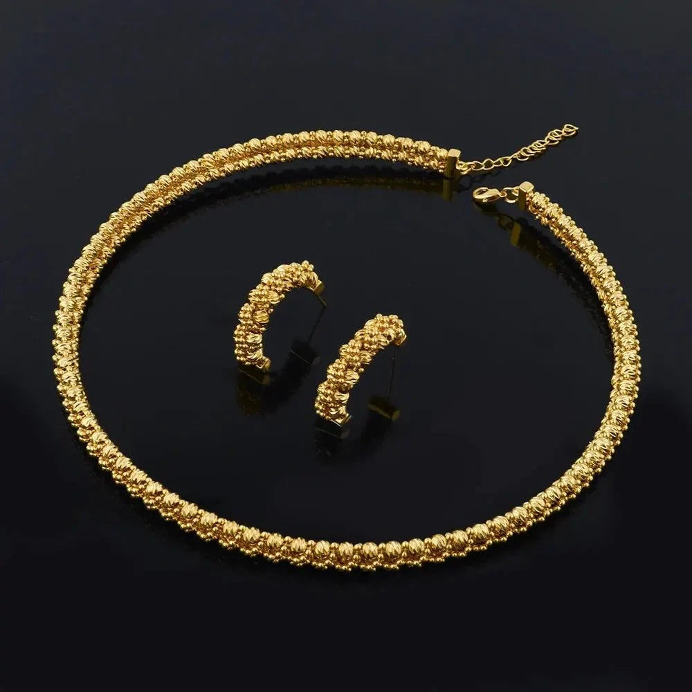 Women's gold plated charm jewellery set featuring matching necklace and earrings, stylish and elegant accessory by TrendLux Wear.