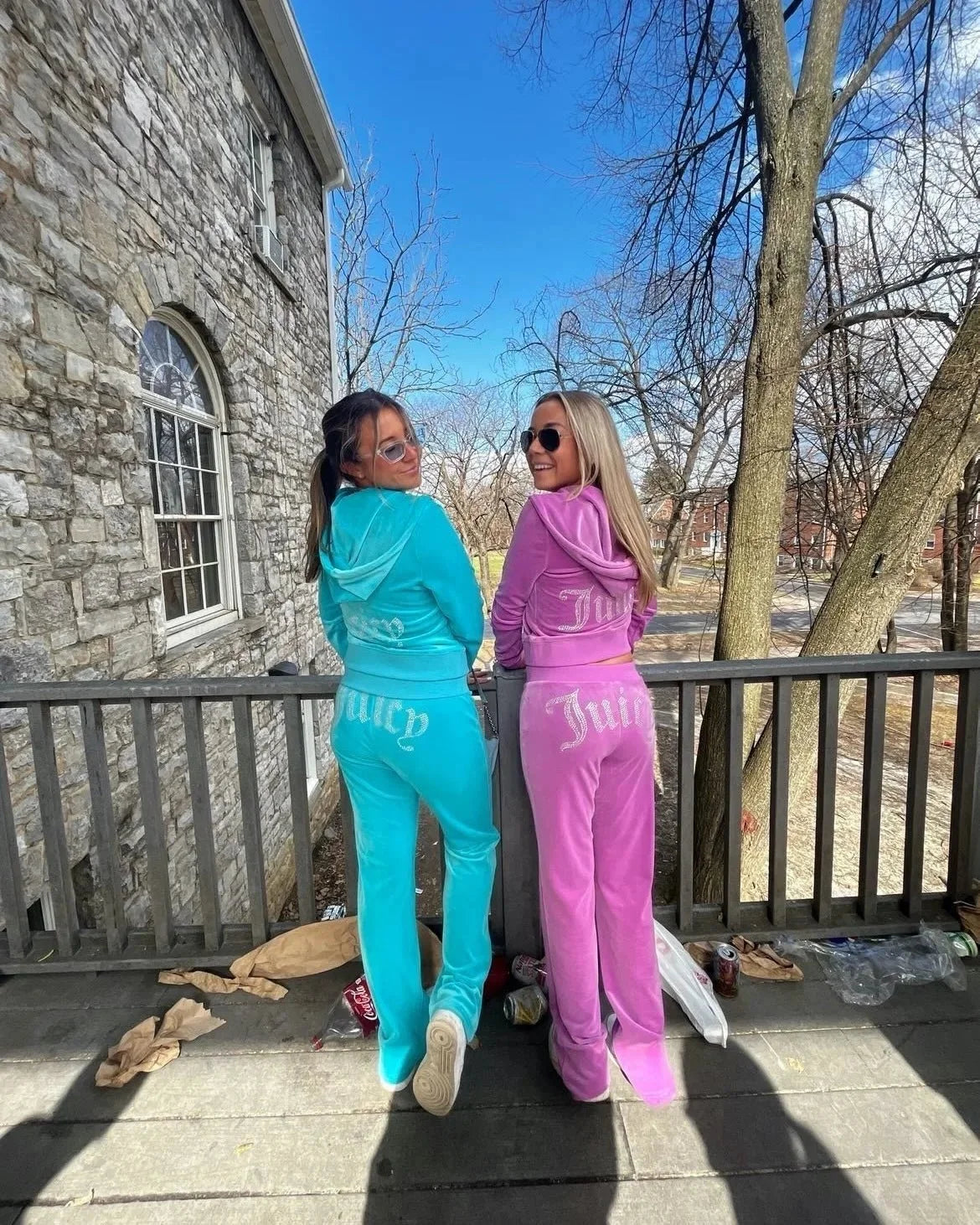 Women's Y2K two-piece hoodie tracksuit by TrendLux Wear, featuring long-sleeve jacket and flare jogger pants in black.